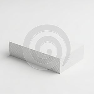 A close-up view of a white textured rectangular object on a white background