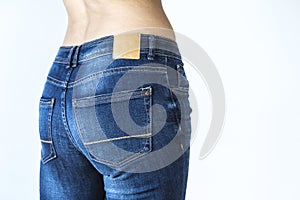 Close up view of woman buttocks with jeans