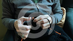 Close-Up View Of Woman Hands Doing Knitting