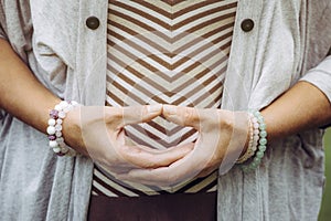 Close up view of woman hands doing meditation Dhyana mudra gesture also known as Samadhi mudra.