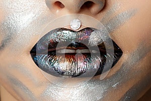 Close up view of woman lips with fashion makeup