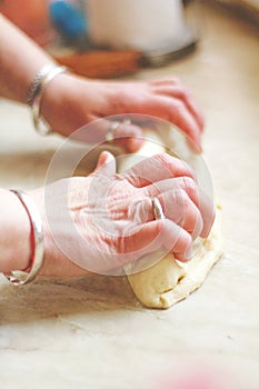 Close Up View Of women Kneading yeast Dough
