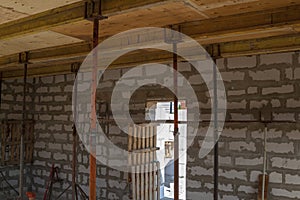 close up view of the wooden formwork with metal holders, which will be filled with the overlap between the floors in the country