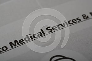Close up view of the word MEDICAL SERVICES. Medical services refer healthcare-related activities, procedures, and interventions to photo