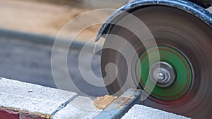 Close-up view of a worker working with angle grinder. Electric wheel grinding on steel structure. Sparks.