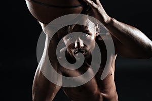 Close-up view of young afroamerican basketball player preparing