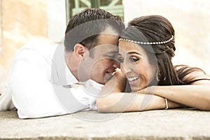 Close up view of young happy bridal couple laughing together
