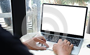 Close up view young man hand typing on keyboard of laptop computer