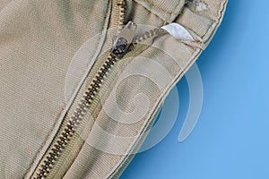 Close up view of zipper on pant. Clothes accessory