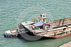 Close-up views of equipments, constructions of  vessel, barges, tugboats and small boats at the roadstead of Halong bay. Port of C