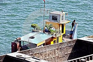 Close-up views of equipments, constructions of  vessel, barges, tugboats and small boats at the roadstead of Halong bay. Port of C