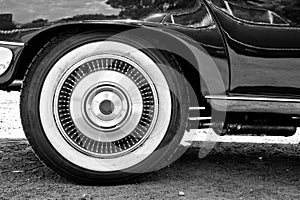 A close up of vintage cars whitewall tire