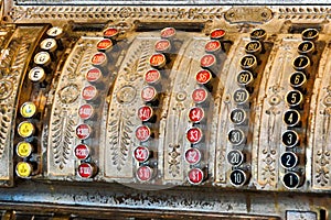 Close up of vintage cash register keys numbers and denominations  - red black, white