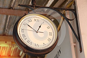 Close up of vintage death clock hang on the vintage zinc roof at vintage train station in province of Asia.