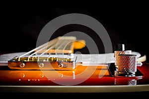 Close up of an vintage electric guitar looking down the neck