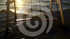 Close up Vintage empty air swing at ocean during sunset surf. Relax 4k footage