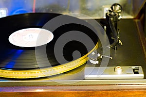 Close up at vintage gramophone. playing old song,Vintage record player with vinyl disc