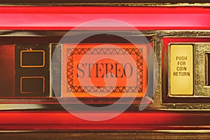 Close up of a vintage jukebox with the text stereo