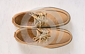 Close up vintage leather shoes man accessory. Men`s casual outfits with accessories on rustic wood .