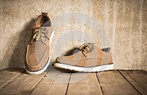 Close up vintage leather shoes man accessory. Men`s casual outfits with accessories on rustic wood .