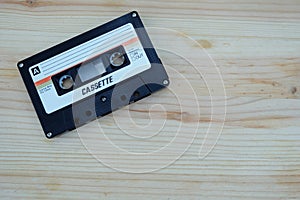 Close up vintage and old audio cassette tape on wooden floors