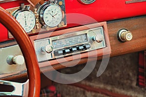 Vintage Porsche steering wheel, car stereo photo