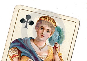 Close up of a vintage queen of clubs playing card.