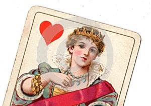 A close up of a vintage queen of hearts playing card.