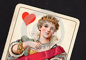 Close up of a vintage queen of hearts playing card.