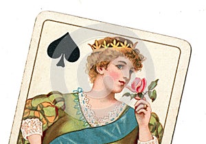 Close up of a vintage queen of spades playing card.