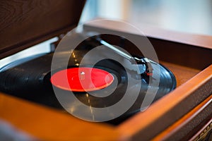 Close up of vintage record player with vinyl disc