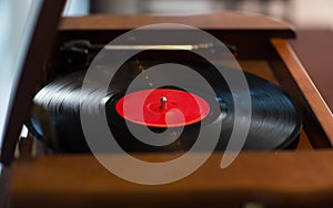 Close up of vintage record player with vinyl disc