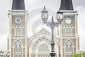 Close up vintage street lamp with The Roman Catholic Diocese background.