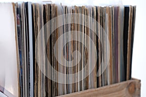 Close-up of vinyl records, antiques, old furniture, tables, used things, clothes and other goods are sold on street, recycling of