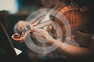 Close-up of a violin - classical music concert - wood detail - Beautiful light and shadows