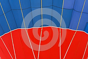 Close-up vivid pattern and texture of hot air balloon. Bright red and blue colors. Abstract background For bright