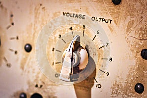 Close-up of a voltage output control knob on a piece of machinery