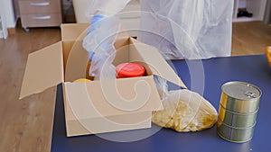 Close up of volunteer packing food photo