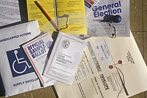 Close-up of a voting booth with ballots