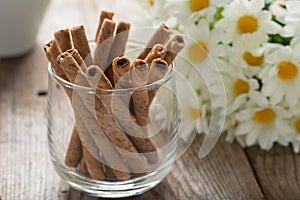 Close up, Wafer roll sticks cream rolls in a cup.