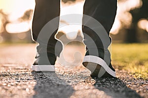 Close up of walking man. Walking outdoors. Closeup on shoe, taking a step