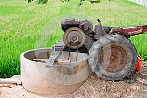 Close up, Walking tractor engine draining or small tractor pumped the water to agriculture field
