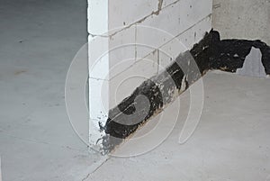 Close up on wall bitumen waterproofing indoors