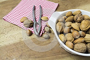 Close up of walnuts, hazelnuts and almonds on wooden table