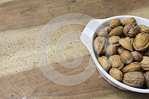 Close up of walnuts, hazelnuts and almonds on wooden table