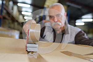 Close up warehouse worker preparing shipment