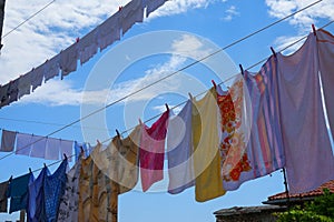 CLOSE UP: Warm summer air dries the freshly washed laundry hung out to dry.