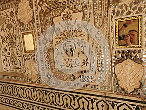 Close up of a wasp nest hanging from the ceiling of a building at outdoors, in Amber Fort near Jaipur, Rajasthan, India