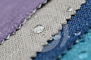 Close up water drop on gunny textile samples. Concept for easy clean, waterproof surfaces