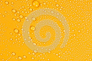 Close up of water drops on yellow tone background. Abstract Black and White